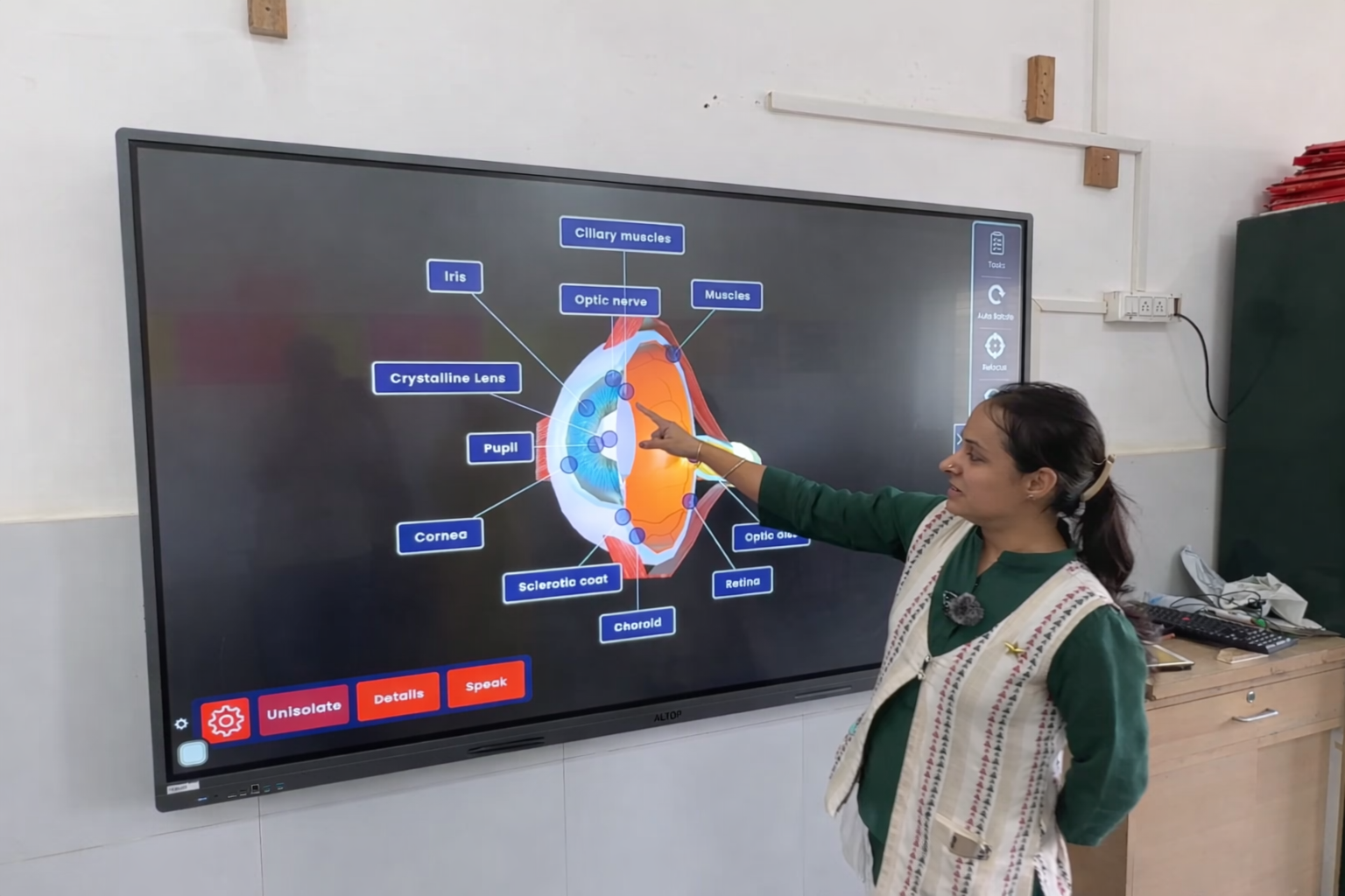 Teacher guiding a classroom science experiment with Dencity.